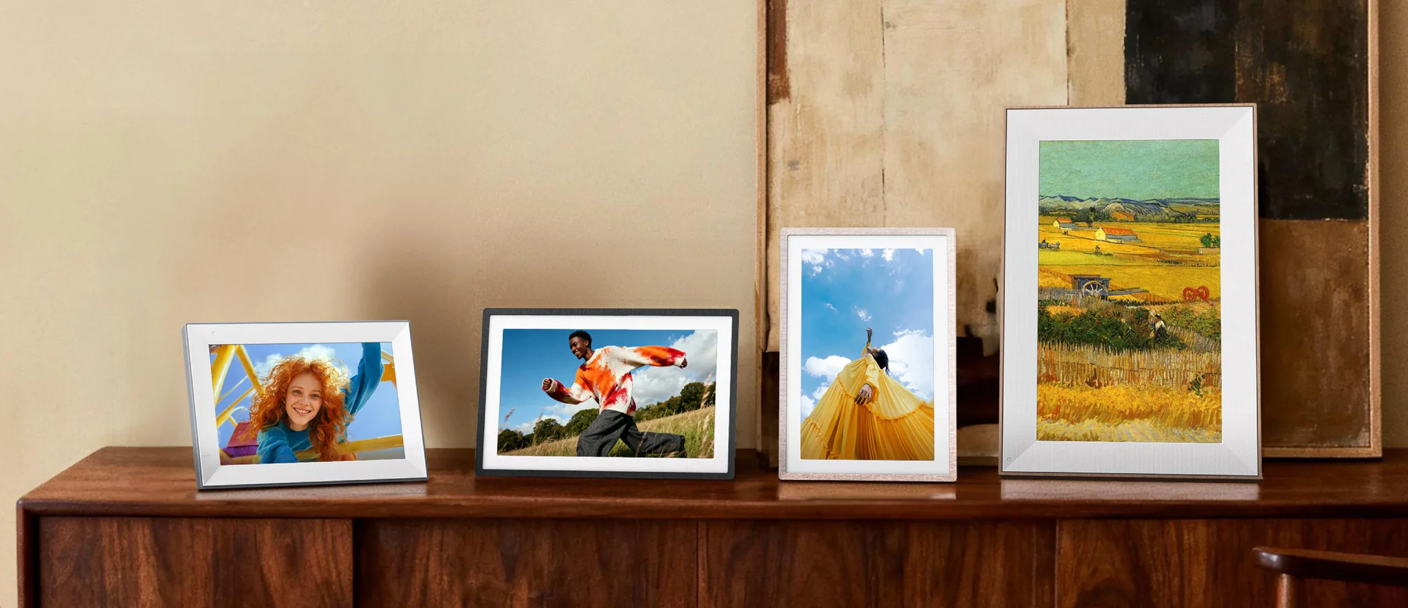 Digital photo frames on a sideboard
