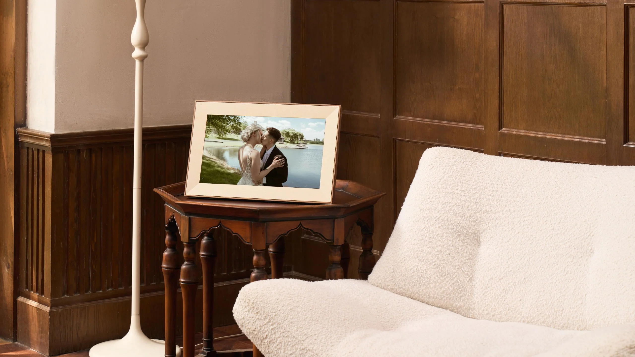 A digital photo frame displaying a wedding photo